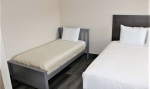 Double Queen Suite with Twin Bed and Kitchenette Photo 2